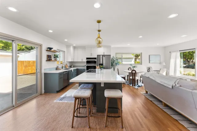 a large kitchen with a table and chairs