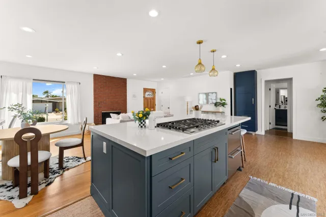 a kitchen with a stove and a kitchen island