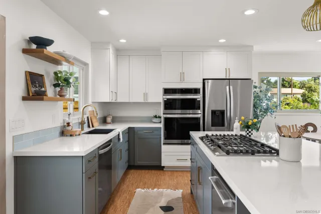 a kitchen with a sink stove and refrigerator