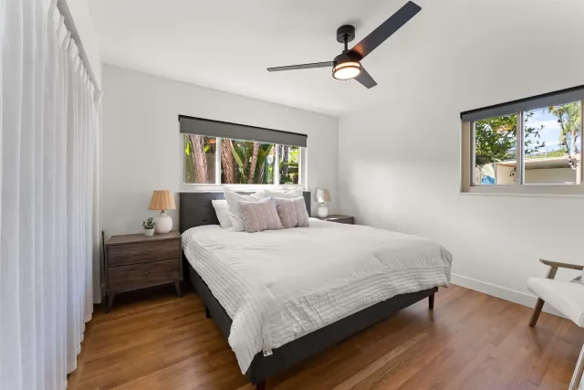 a bedroom with a bed and chair