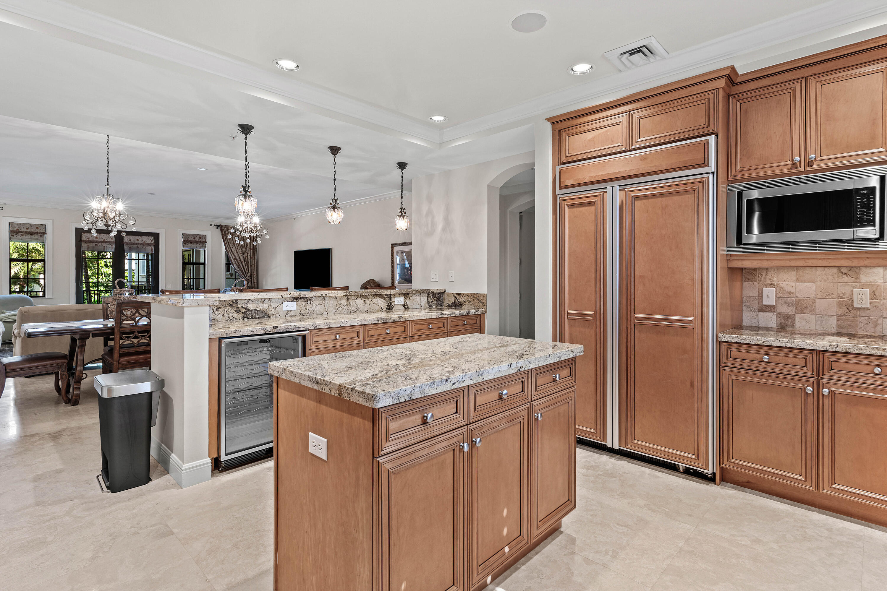 110 Gleason Street, Unit 203 Delray Beach, FL 33483 - Photo 4 of 25 a kitchen with cabinets and stainless steel appliances