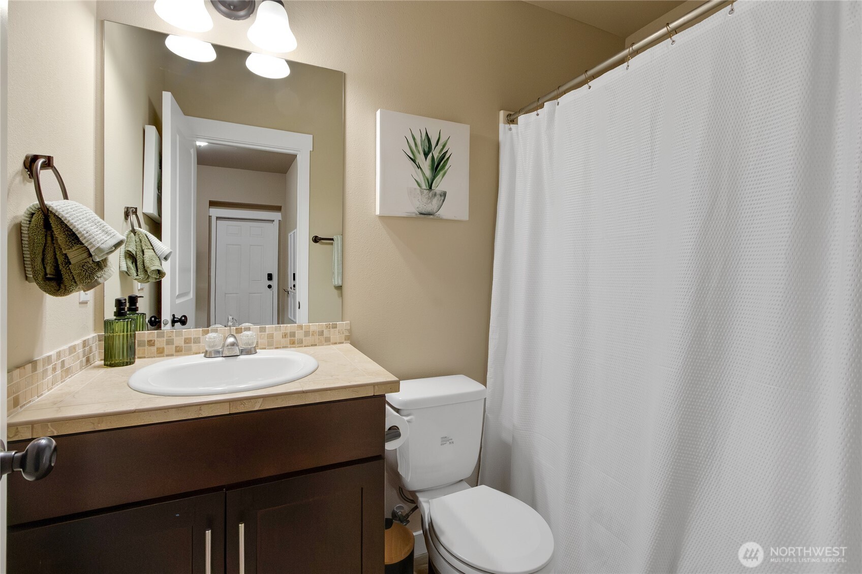 889 Lund Street Buckley, WA 98321 - Photo 17 of 25 a bathroom with a sink vanity mirror and toilet