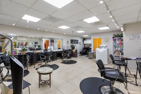 a room with gym equipment and a view of living room