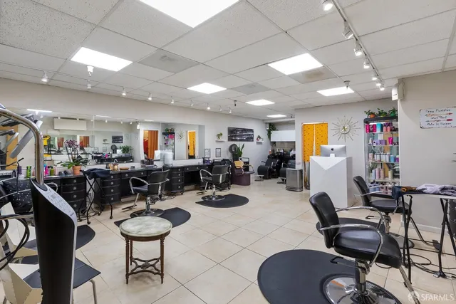 a room with gym equipment and a view of living room