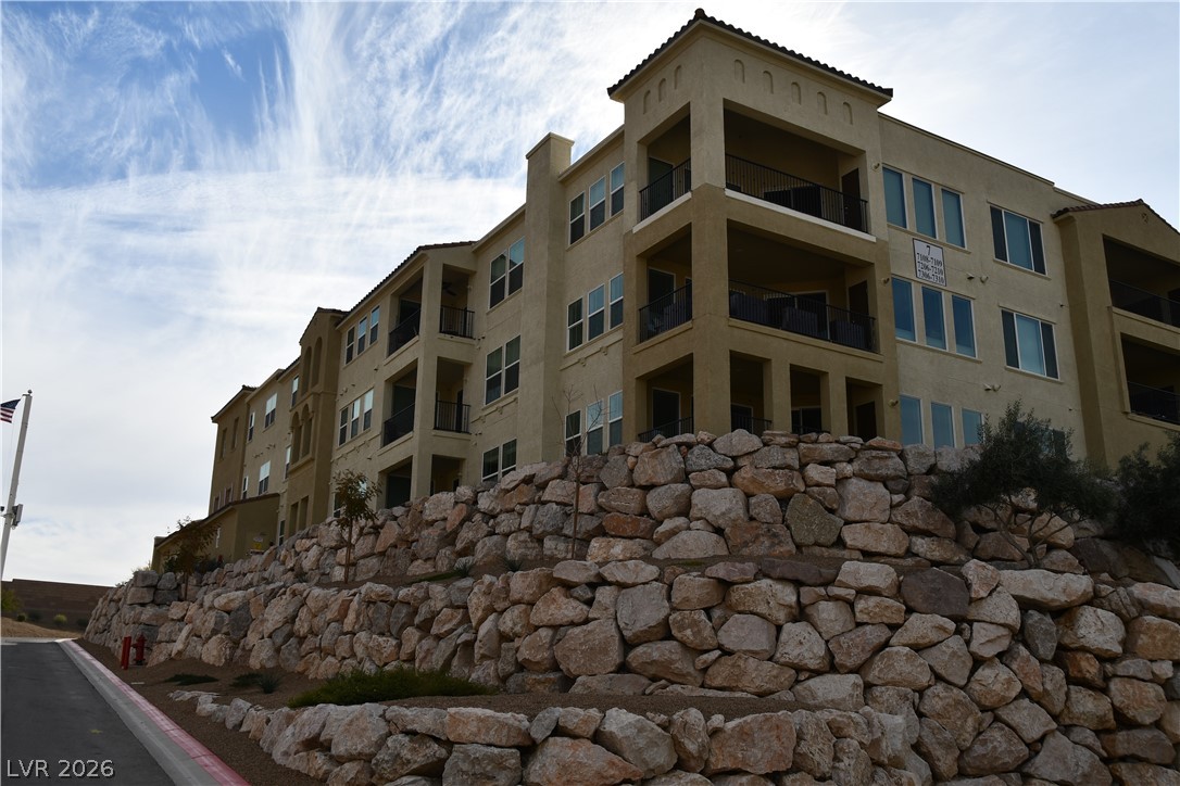 2555 Hampton Road, Unit 7109 Henderson, NV 89052 - Photo 4 of 34 Multi-level living meets desert landscape in this captivating building with balconies.