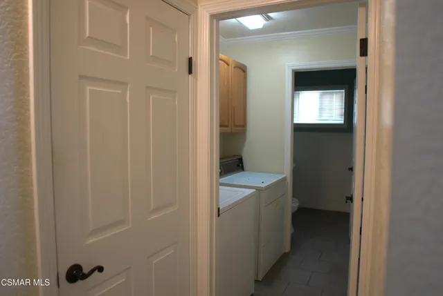 a bathroom with a toilet sink and window