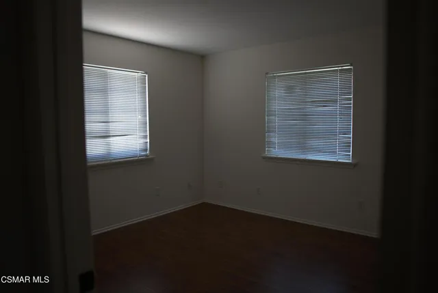 a view of a livingroom with an empty space and window