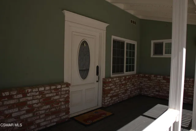 a bathroom with a glass door