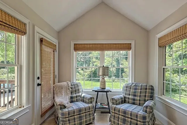 a living room with furniture and a window