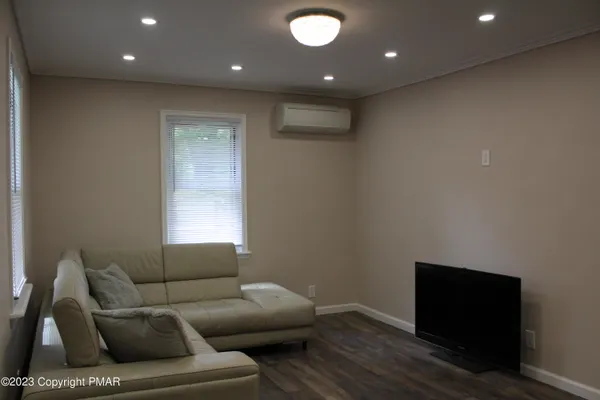 a living room with furniture and a window