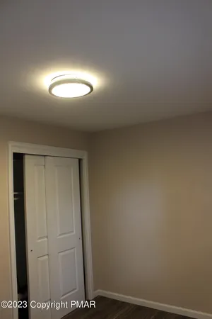 a bathroom with a shower a toilet and sink