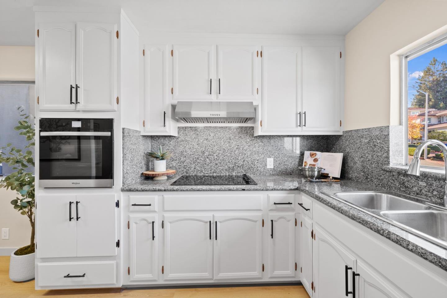 1250 Tuolumne Road Millbrae, CA 94030 - Photo 11 of 56 a kitchen with stainless steel appliances granite countertop a sink a stove and a microwave