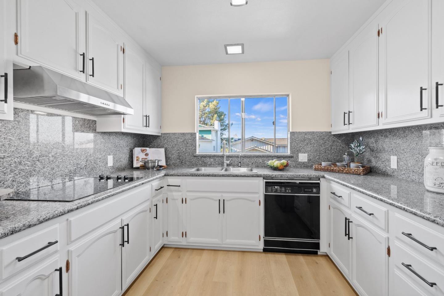 1250 Tuolumne Road Millbrae, CA 94030 - Photo 12 of 56 a kitchen with granite countertop white cabinets and white appliances