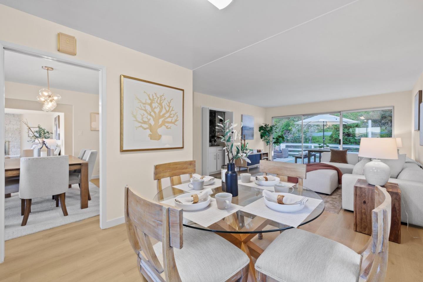 1250 Tuolumne Road Millbrae, CA 94030 - Photo 17 of 56 a dining room with furniture a large window and garden view
