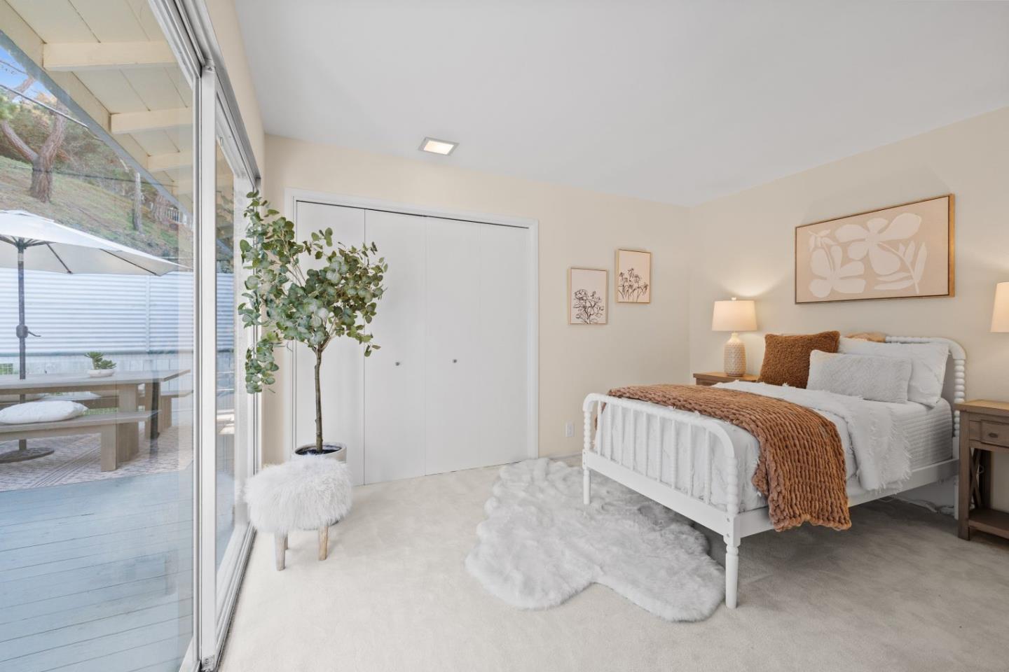 1250 Tuolumne Road Millbrae, CA 94030 - Photo 29 of 56 a spacious bedroom with a bed and a potted plant