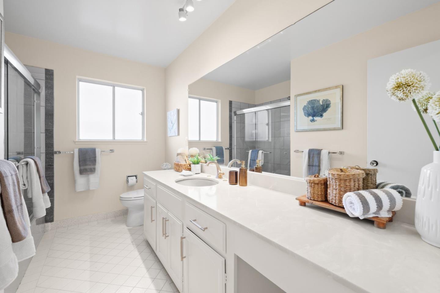 1250 Tuolumne Road Millbrae, CA 94030 - Photo 31 of 56 a spacious bathroom with a double vanity sink a mirror and a bathtub