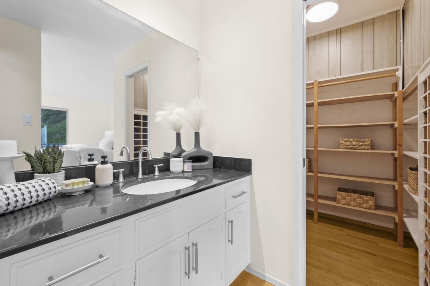 1250 Tuolumne Road Millbrae, CA 94030 - Photo 35 of 56 a bathroom with a double vanity sink and a mirror