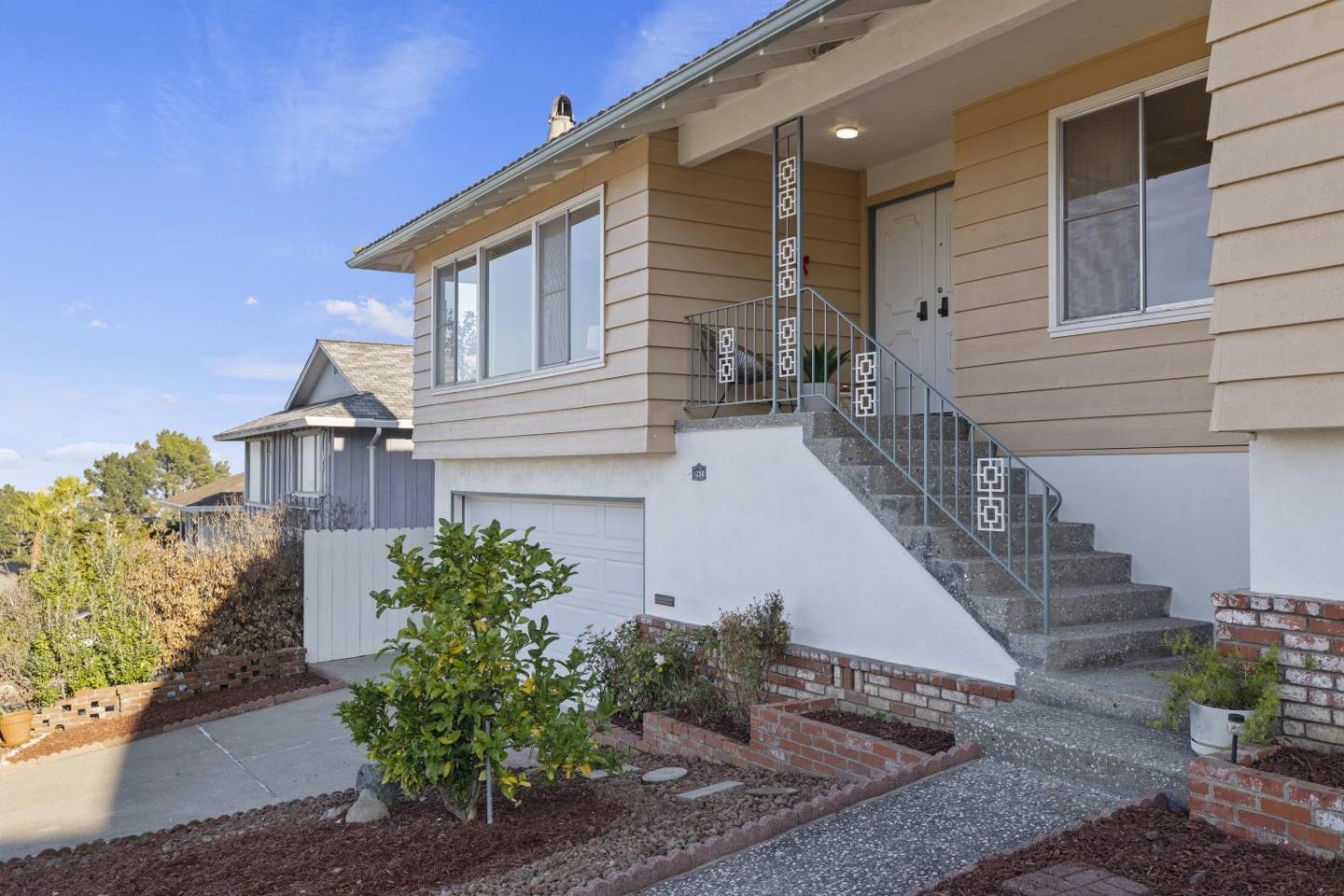 1250 Tuolumne Road Millbrae, CA 94030 - Photo 54 of 56 a view of a house with a small yard and plants