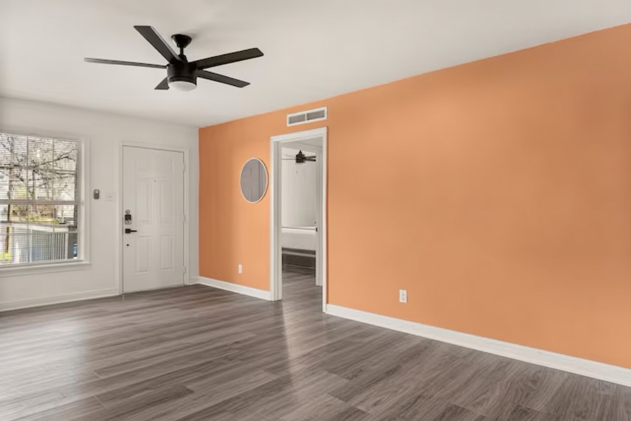 2509 Quarry Road, Unit A Austin, TX 78703 - Photo 2 of 3 A welcoming entry space with sleek flooring and a contemporary ceiling fan.