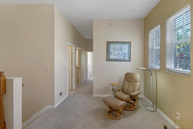 a living room with furniture and a chair