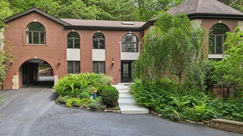 a front view of a house with garden