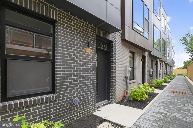 a brick building with a white door