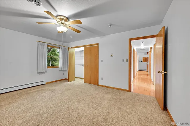 a view of a bathroom with a sink and mirror