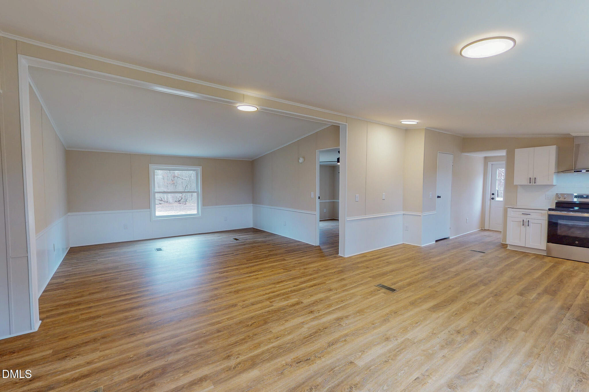 67 Halifax Road Roxboro, NC 27574 - Photo 2 of 48 a view of empty room with wooden floor and kitchen