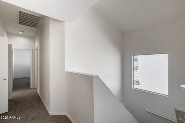 a view of hallway with stairs