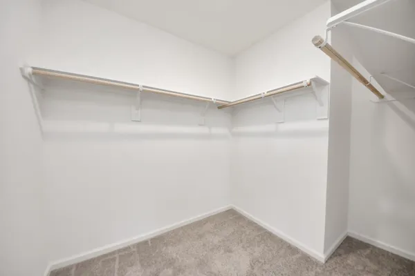 a bathroom with a double vanity sink mirror and toilet