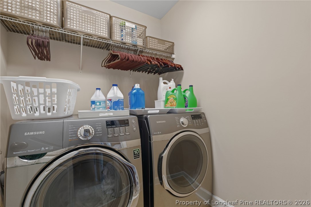 126 Pine Hawk Drive Spring Lake, NC 28390 - Photo 24 of 48 a utility room with dryer and washer