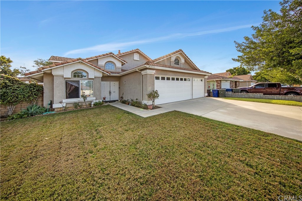 20249 June Riverside, CA 92508 - Photo 1 of 1 a view of a house with a yard and large trees