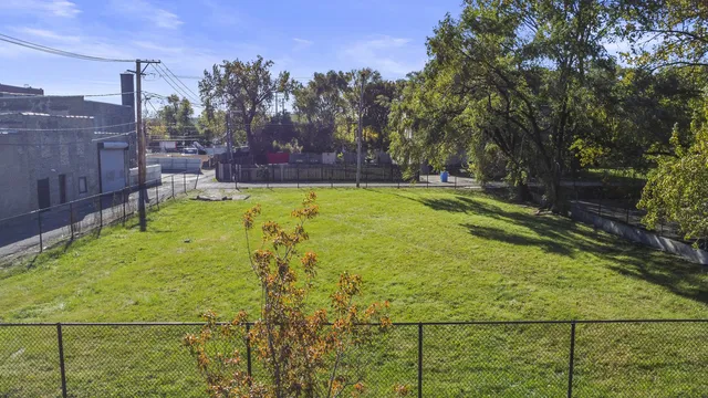 a view of yard with swimming pool
