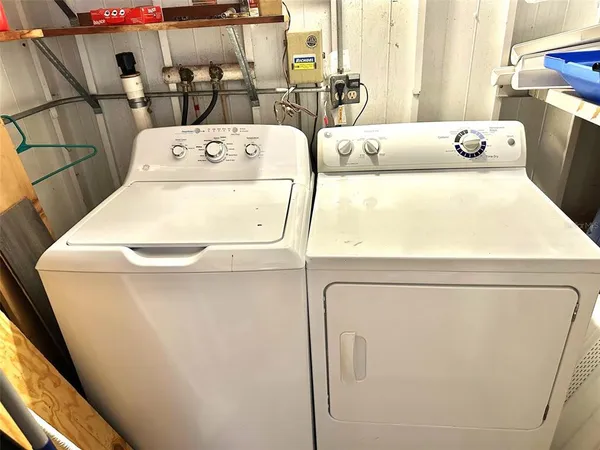a utility room with dryer and washer