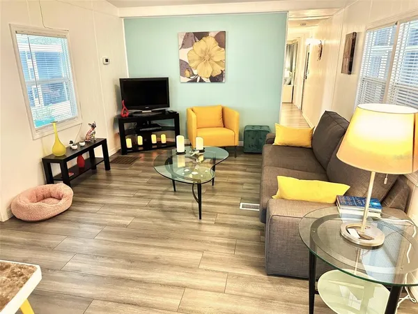a living room with fireplace furniture and a flat screen tv