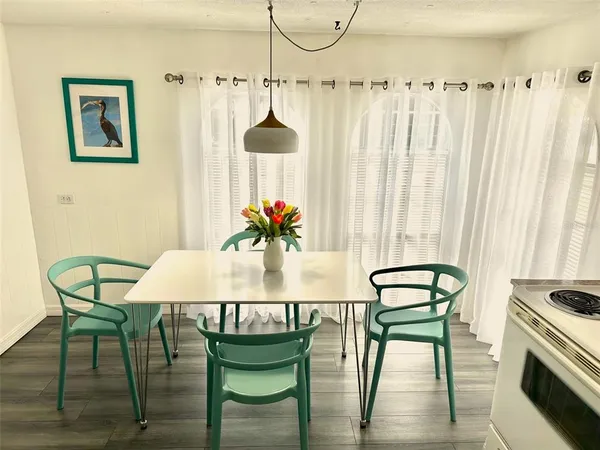 a dining room with furniture and window