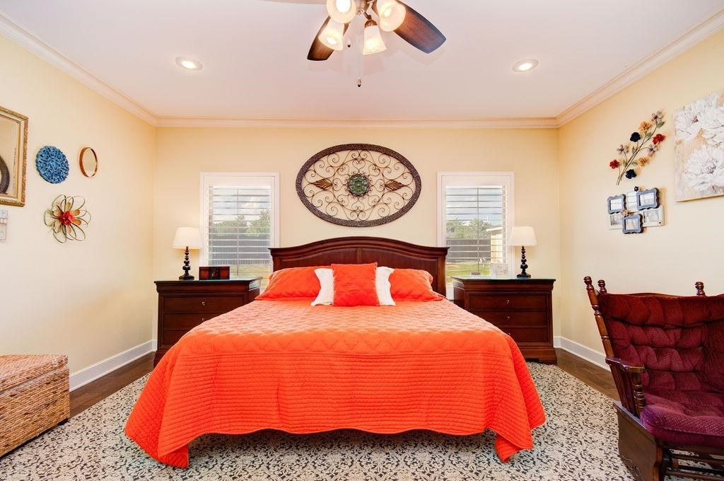 6506 15th Drive Lubbock, TX 79416 - Photo 20 of 42 a bedroom with a bed and a painting on the wall