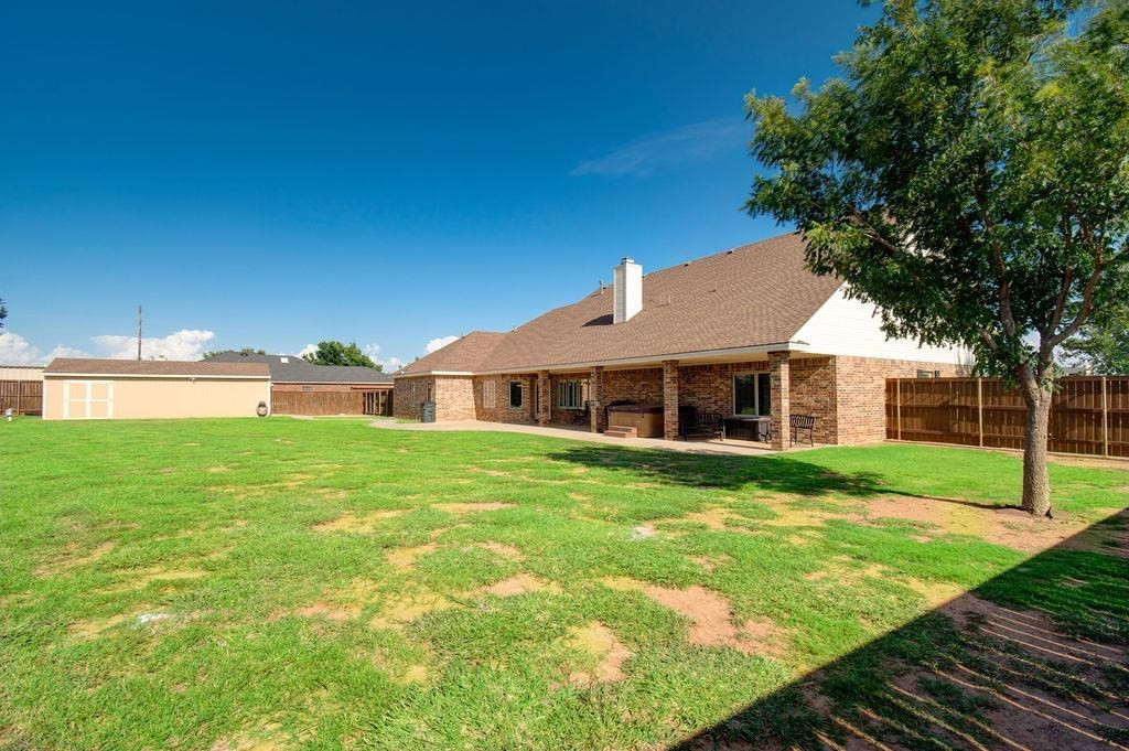6506 15th Drive Lubbock, TX 79416 - Photo 39 of 42 a view of a house with a yard