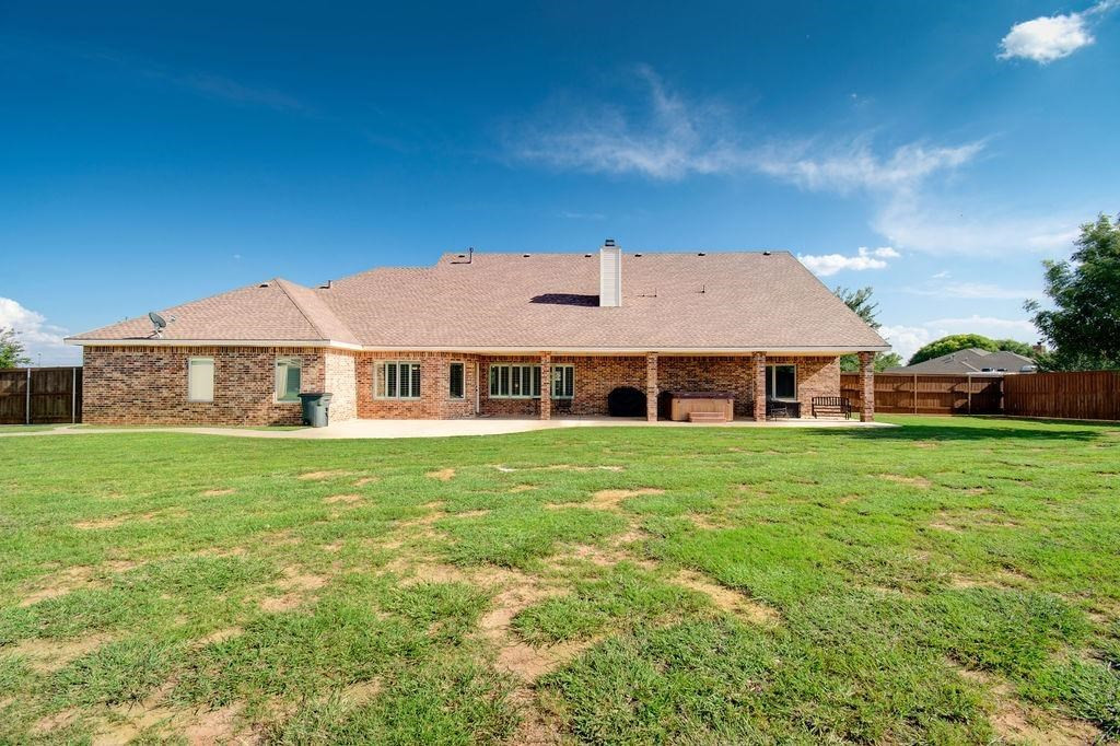 6506 15th Drive Lubbock, TX 79416 - Photo 40 of 42 a front view of a house with a garden
