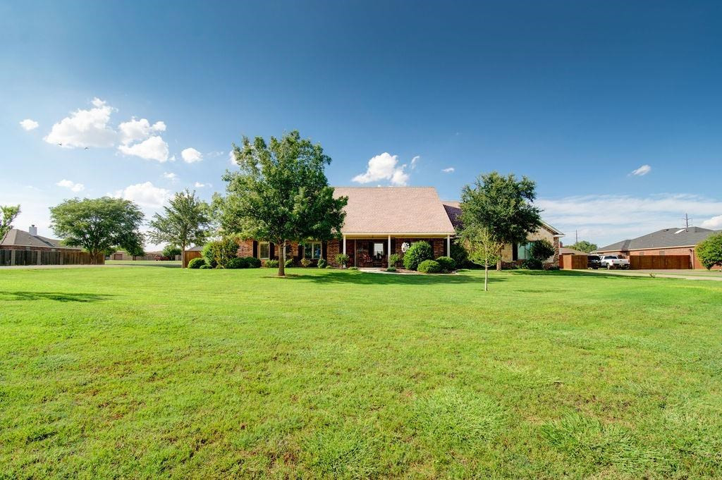 6506 15th Drive Lubbock, TX 79416 - Photo 42 of 42 a front view of a house with garden