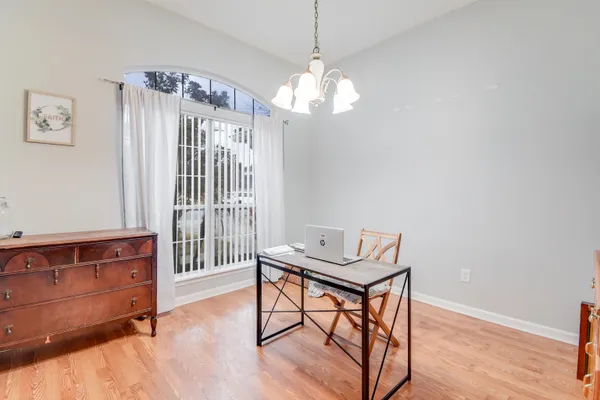 a bedroom with a bed and a table in it