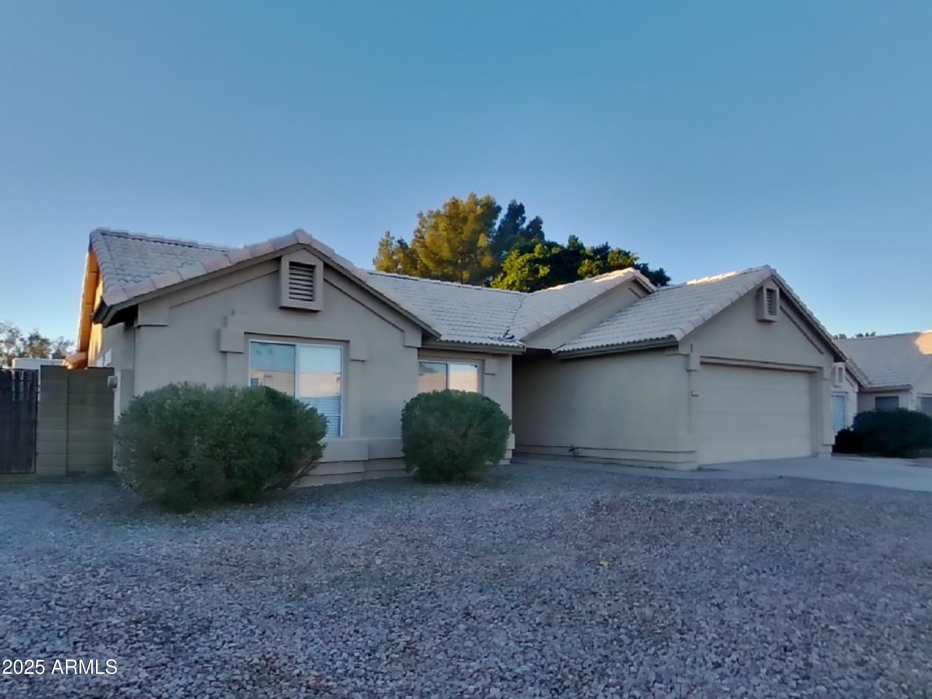 7455 East McLellan Road Mesa, AZ 85207 - Photo 1 of 16 a view of a house with a yard