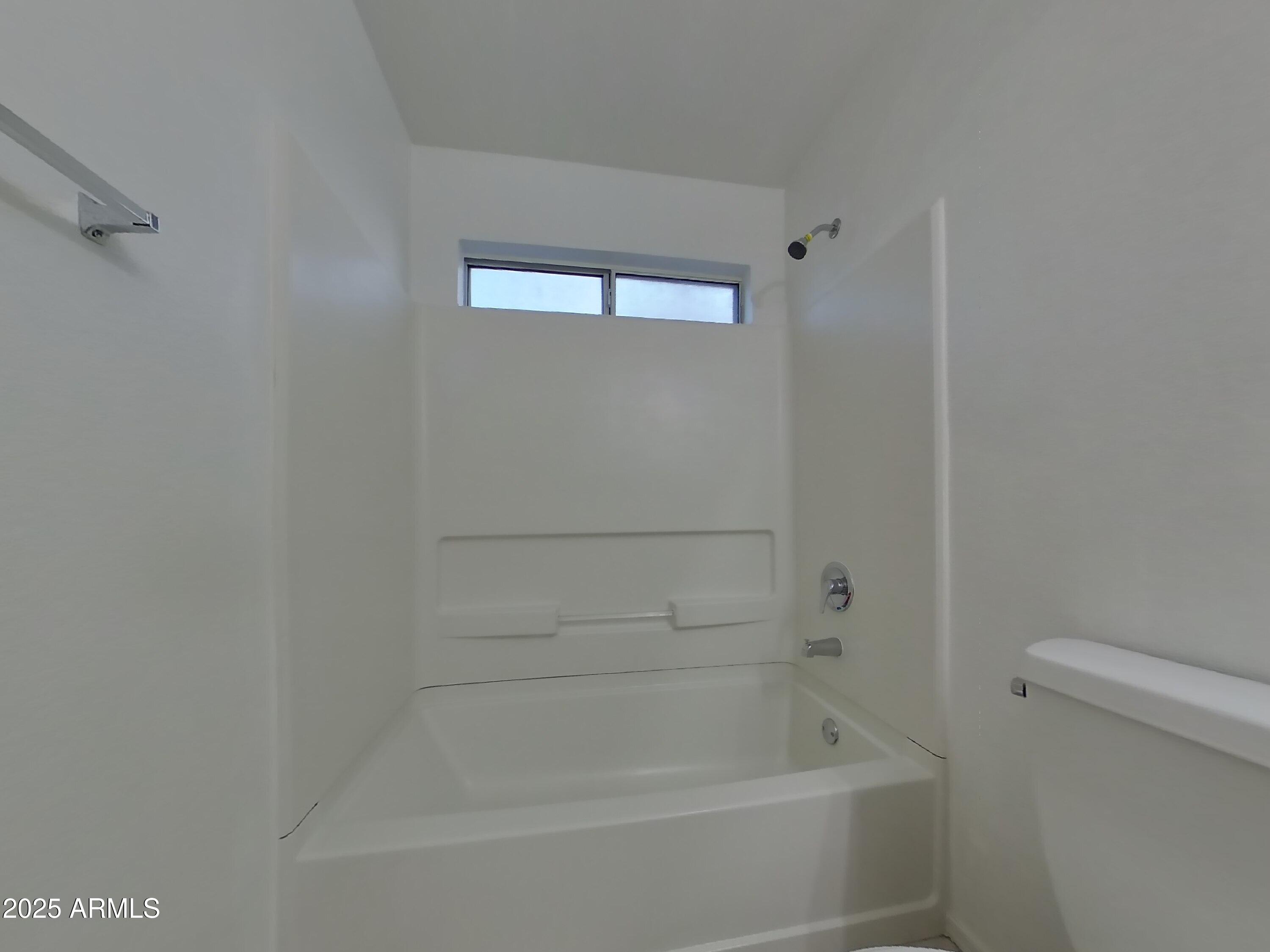 7455 East McLellan Road Mesa, AZ 85207 - Photo 12 of 16 a bathroom with a bathtub