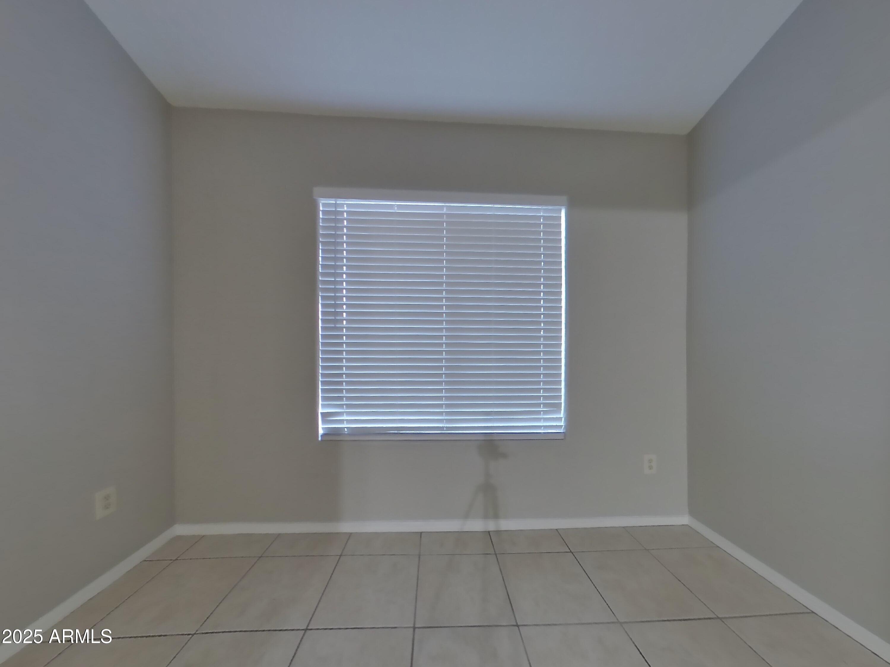 7455 East McLellan Road Mesa, AZ 85207 - Photo 14 of 16 a view of an empty room with a window