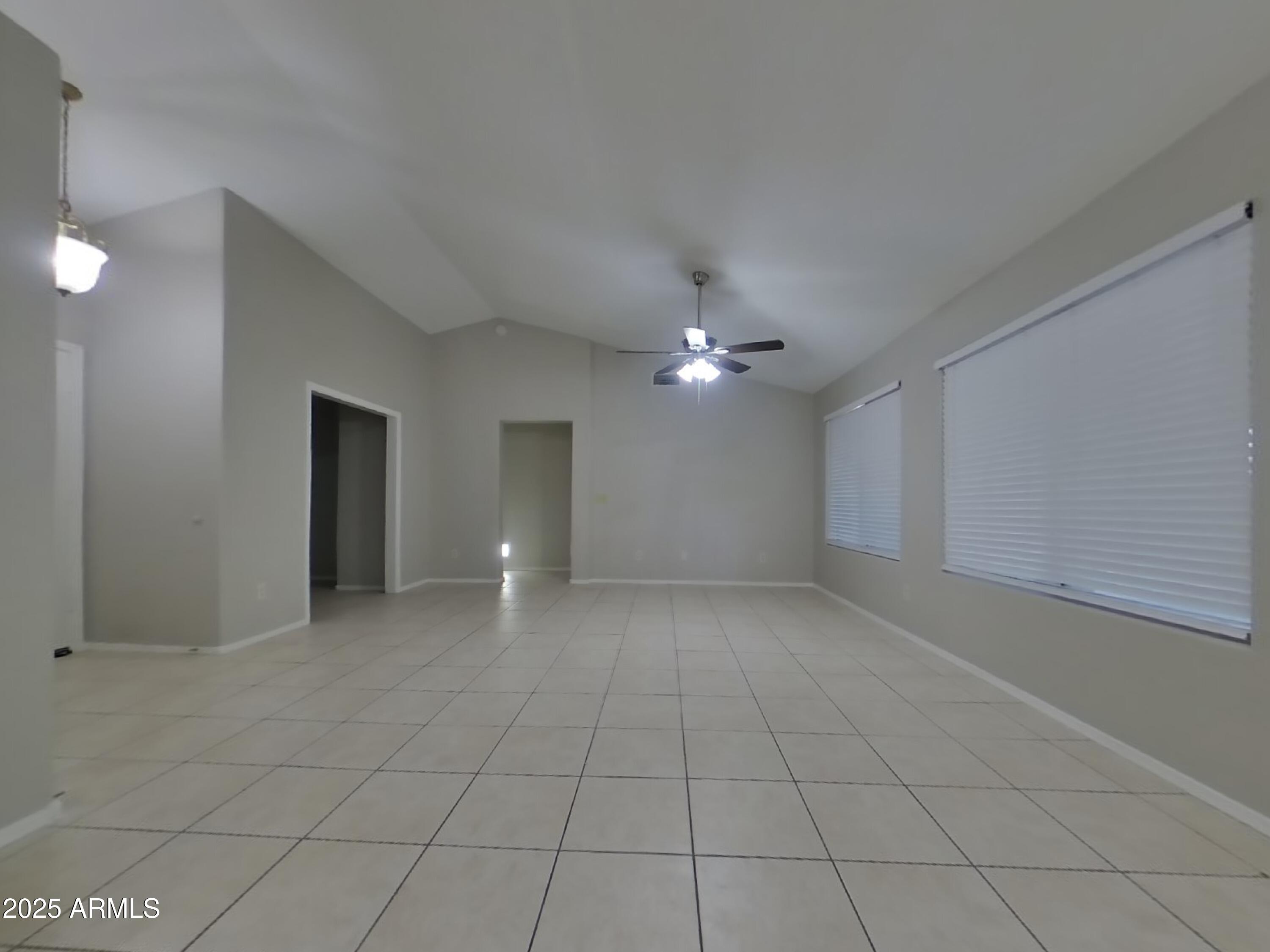 7455 East McLellan Road Mesa, AZ 85207 - Photo 2 of 16 a view of an empty room with a window