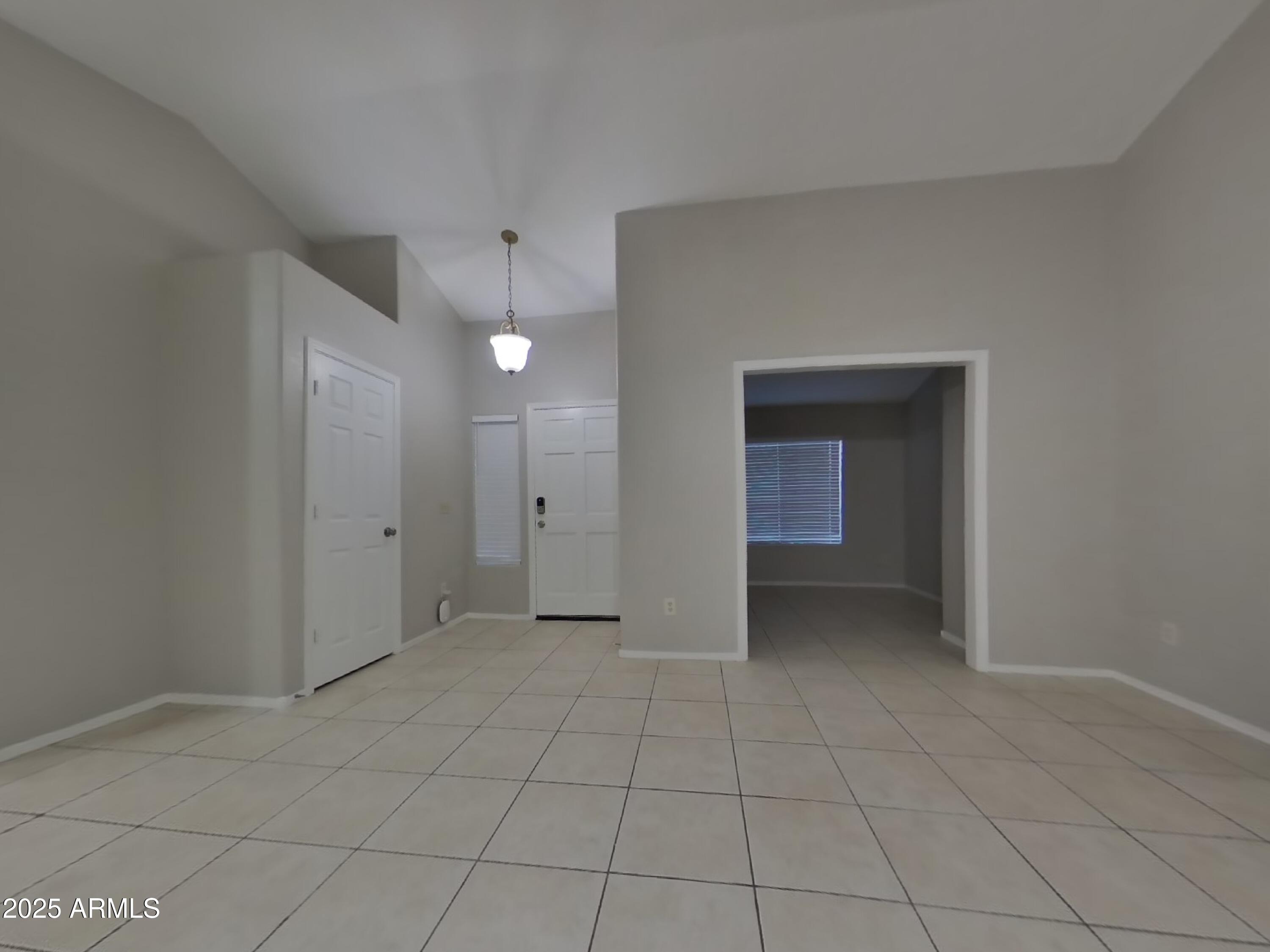 7455 East McLellan Road Mesa, AZ 85207 - Photo 3 of 16 a view of an empty room with closet and a window