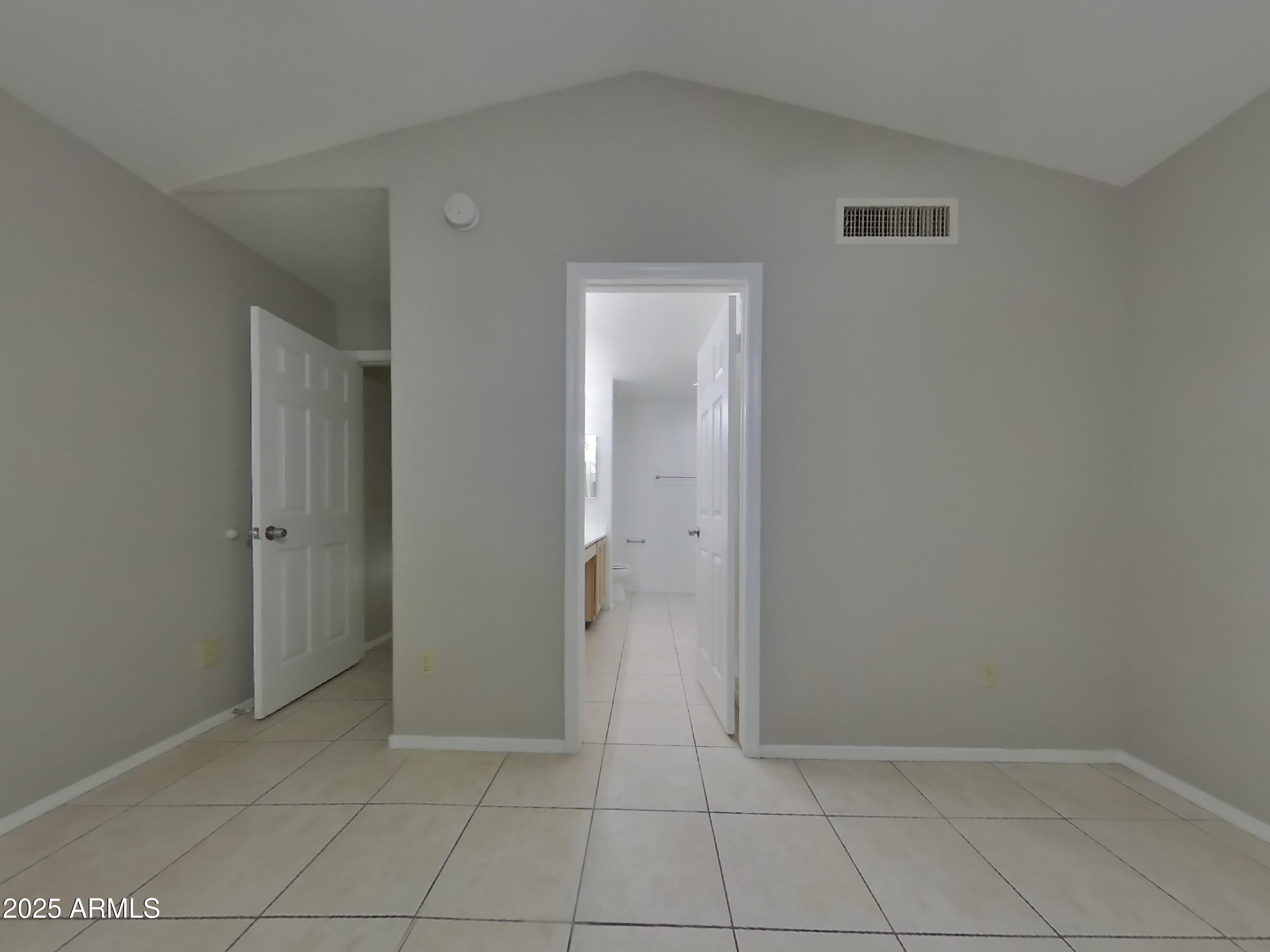 7455 East McLellan Road Mesa, AZ 85207 - Photo 6 of 16 a view of an empty room with window