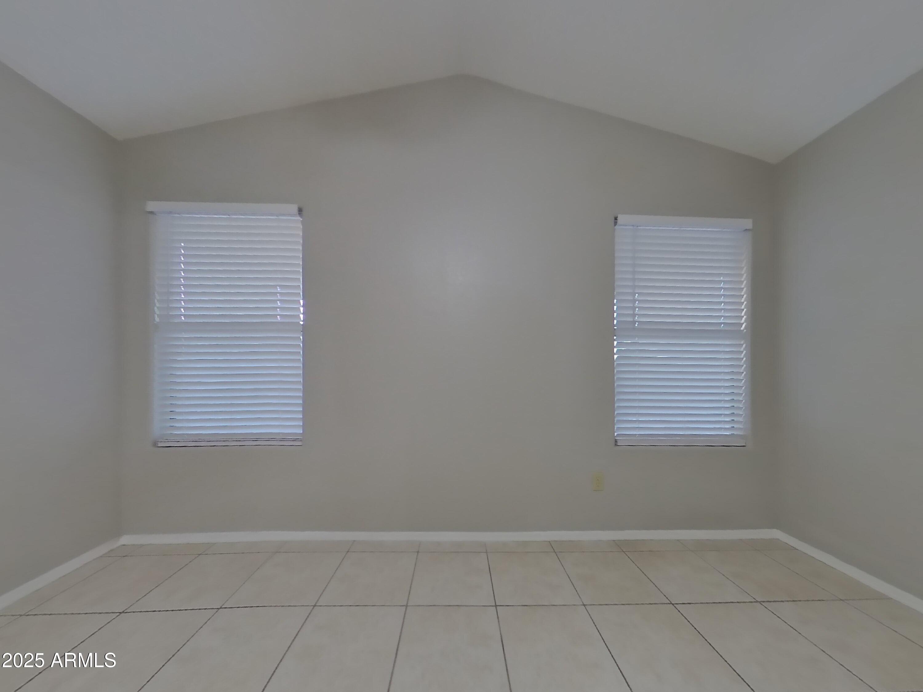 7455 East McLellan Road Mesa, AZ 85207 - Photo 7 of 16 an empty room with a window