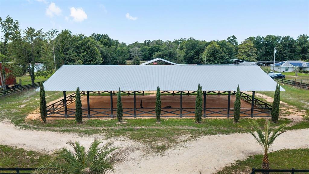 16392 Northeast Jacksonville Road Citra, FL 32113 - Photo 18 of 44 an outdoor view of a house with garden