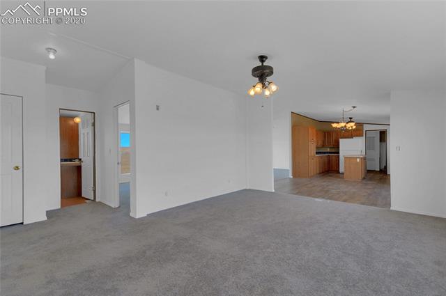 8650 Mulberry Road Calhan, CO 80808 - Photo 6 of 17 Family Room Looking to Kitchen/Dining and Bedroom/Bath